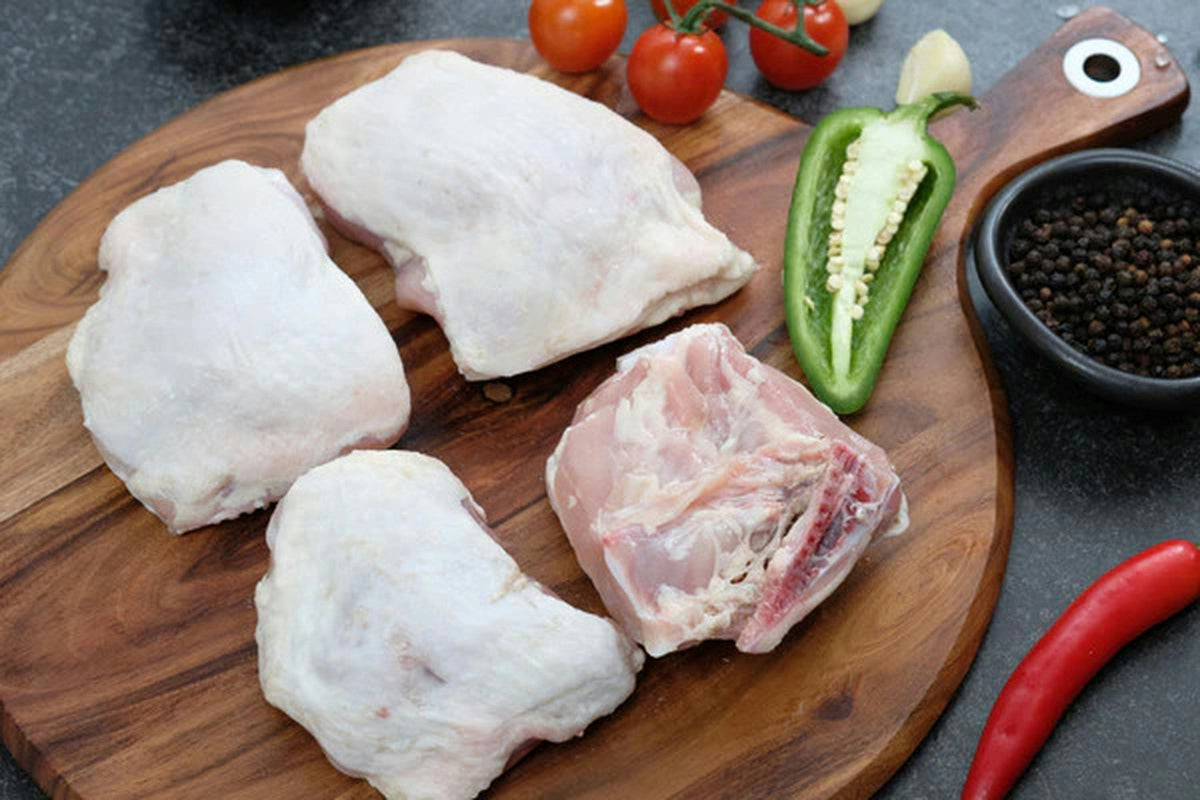 Raw bone-in chicken thighs included in The Healthy Family Box
